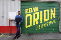 In this Monday, Oct. 28, 2019 photo, Seattle City Council candidate Egan Orion poses for a photo at his headquarters in Seattle. Seven of the nine Seattle City Council seats are up for grabs in next month's election, where retail giant Amazon has made unprecedented donations totaling $1.5 million to a political action committee that's supporting a slate of candidates perceived to be friendlier to business. Among the company's top targets is socialist council member Kshama Sawant, a fierce critic of Amazon, and Orion's opponent in the District 3 race. (AP Photo/Elaine Thompson)