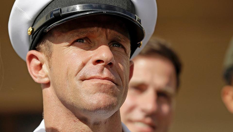 FILE - In this Tuesday, July 2, 2019, file photo, Navy Special Operations Chief Edward Gallagher leaves a military court on Naval Base San Diego. The attorney for Gallagher, convicted of posing with a dead captive in Iraq, says the Navy is trying to remove the special operations chief from the elite fighting force in retaliation for President Donald Trump restoring his rank. Defense attorney Timothy Parlatore said the Navy is holding a review board proceeding to remove Edward Gallagher's Trident pin and summoned him to meet with the SEAL leadership on Wednesday, Nov. 20, 2019. (AP Photo/Gregory Bull, File) ORG XMIT: LA301