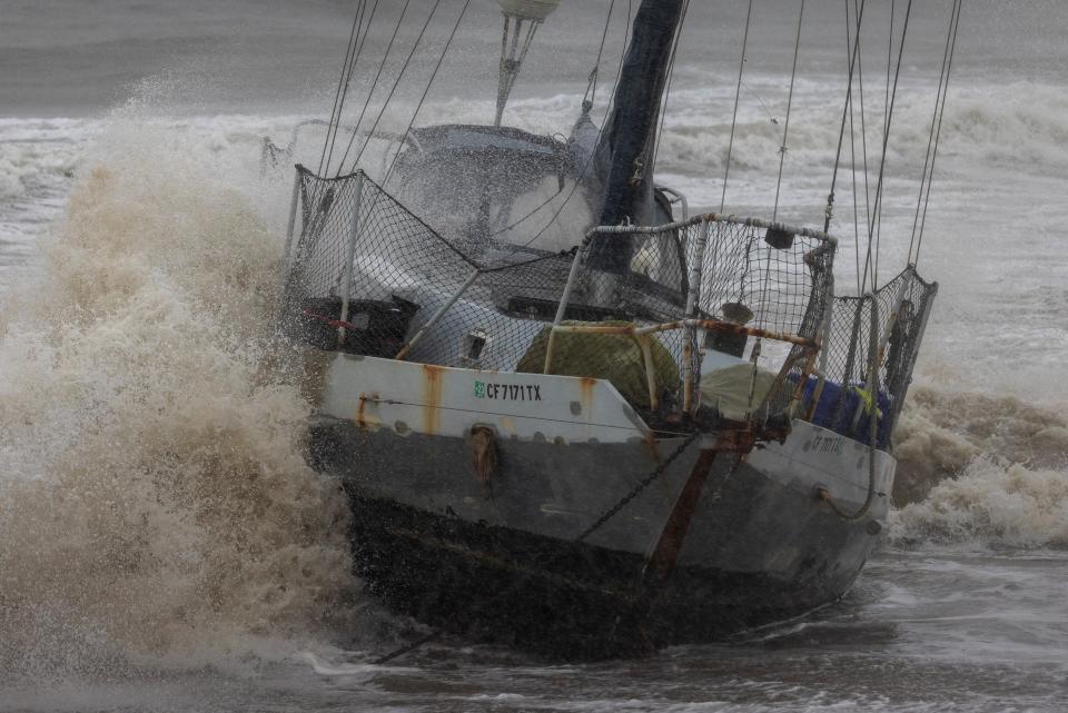 A boat washes ashore as the second and more powerful of two atmospheric river storms, and potentially the biggest storm of the season, arrives to Santa Barbara, California, on February 4, 2024. The US West Coast was getting drenched on February 1 as the first of two powerful storms moved in, part of a u0022Pineapple Expressu0022 weather pattern that was washing out roads and sparking flood warnings. The National Weather Service said u0022the largest storm of the seasonu0022 would likely begin on February 4.