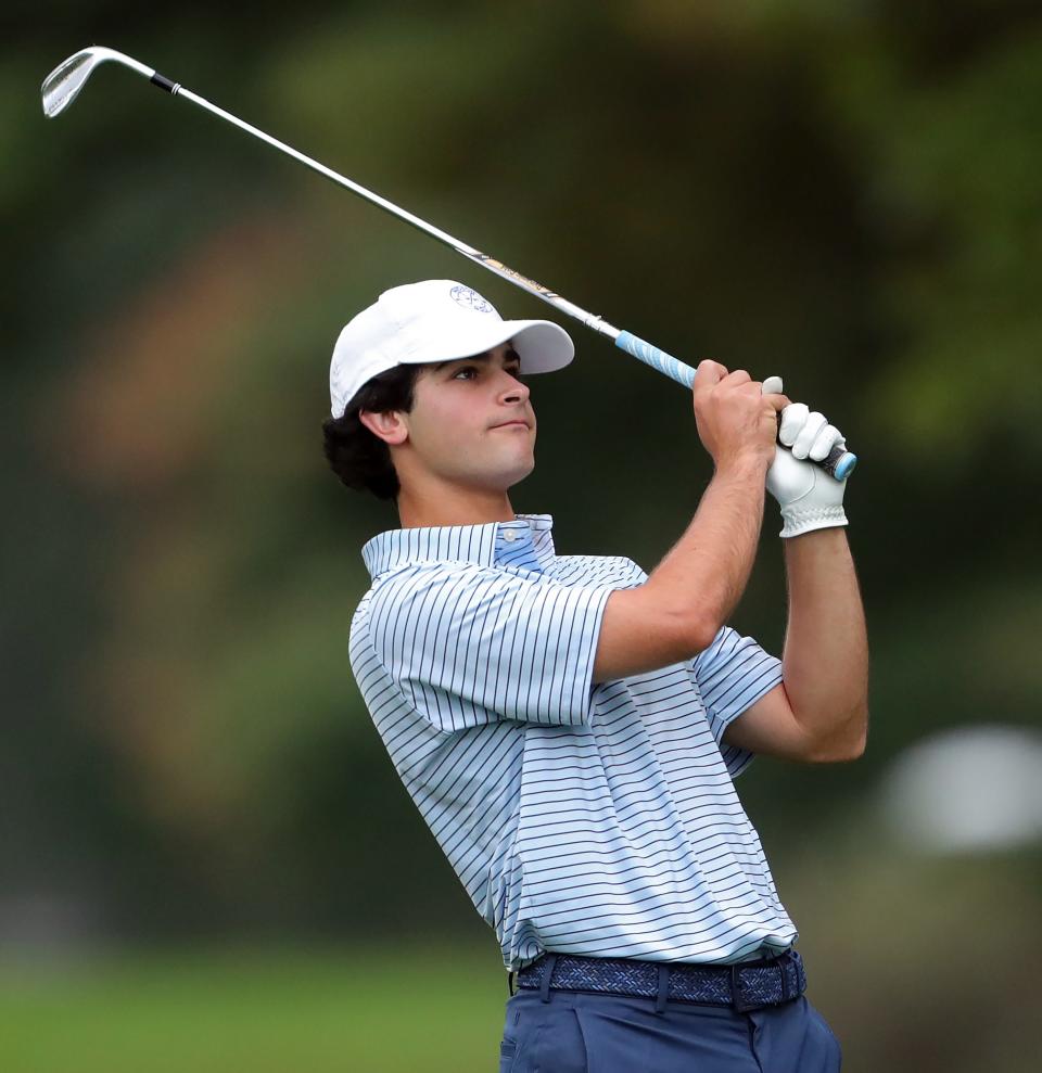 Hudson's Sam Fauver watches his approach from the No. 16 fairway during the Suburban League golf tournament Thursday at J.E. Good Park Golf Course in Akron.