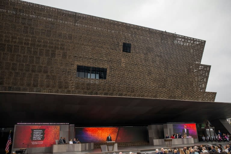 Washington's new African American Museum features three inverted-pyramid tiers sheathed in bronze-painted filigree panels, housing more than 34,000 objects