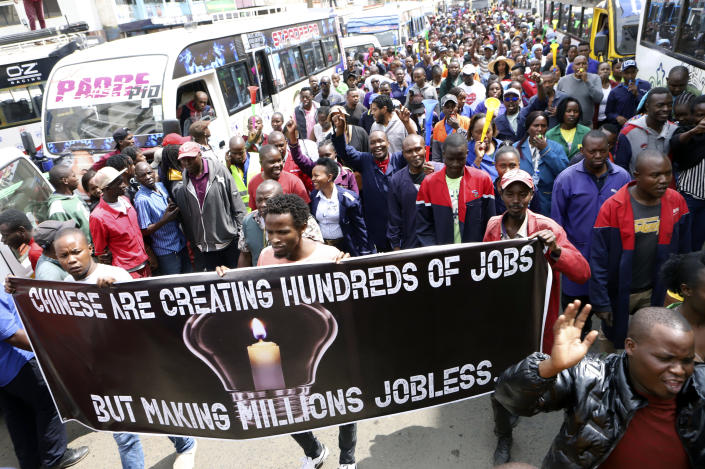 Small and medium business traders and other demonstrators carry banners as they protest asking the government to chase Chinese traders away, in Nairobi, Kenya, Tuesday, Feb. 28, 2023. The traders carried banners with Anti-Chinese messages and chanted 'Chinese must go', claiming Chinese businesspeople have flooded the city with counterfeit and cheap products, killing Kenyan businesses. (AP Photo)