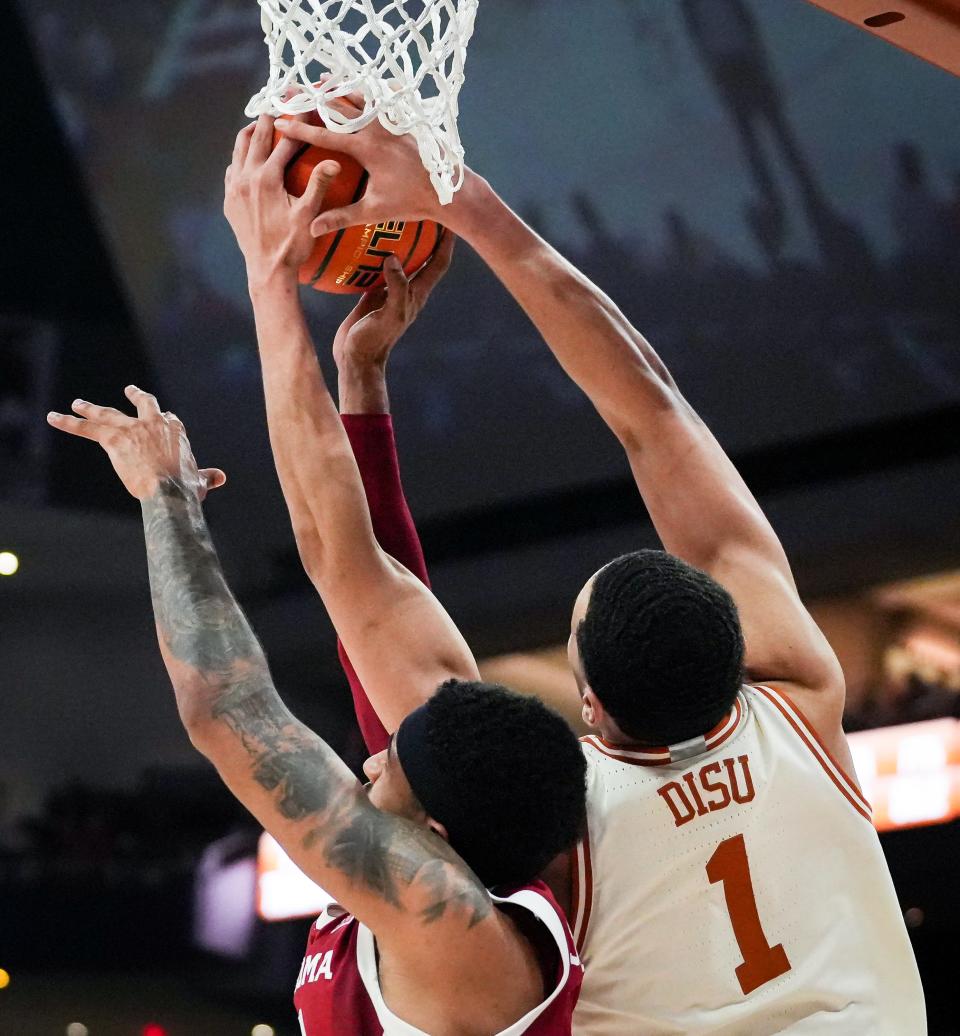 Texas forward Dylan Disu battles Oklahoma guard Rivaldo Soares for a rebound during last Saturday's win at Moody Center. Disu was named the Big 12's most improved player on Sunday. The Longhorns open their Big 12 Tournament on Wednesday against Kansas State.