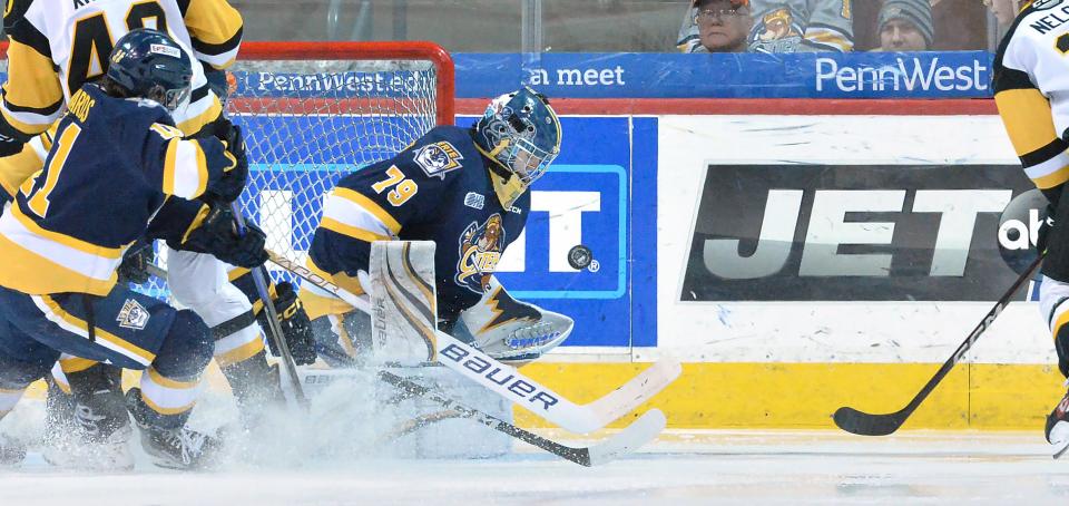 Erie Otters goaltender Nolan Lalonde, center, stops a Hamilton Bulldogs shot inside Erie Insurance Arena in Erie on Feb. 28. Lalonde is one of six current or former Otters players assigned to an NHL development camp.