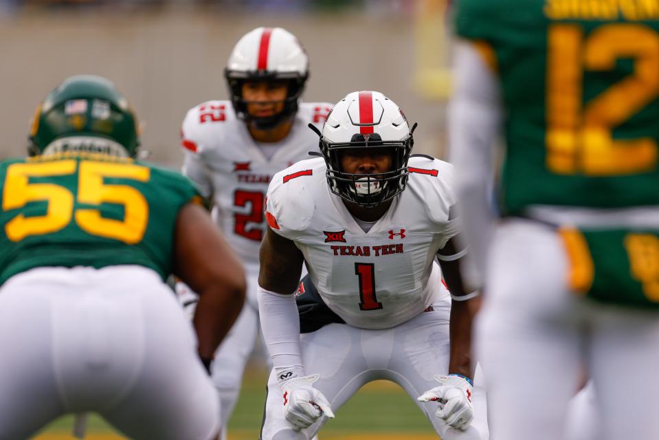 Texas Tech linebacker Krishon Merriweather (1) and safety Reggie Pearson (22) zero in on the Baylor offense during the Red Raiders' 27-24 loss last year in Waco. The two teams meet again Saturday at Jones AT&T Stadium.