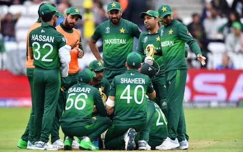 Pakistan's captain Sarfaraz Ahmed speaks with his players - Credit: AFP