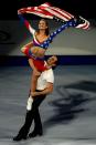 <p>American Tanith Belbin took patriotism to another level in her bedazzled USA inspired ice dancing dress. Her partner, Benjamin Agosto, was more understated in a white shirt and black pants. </p>