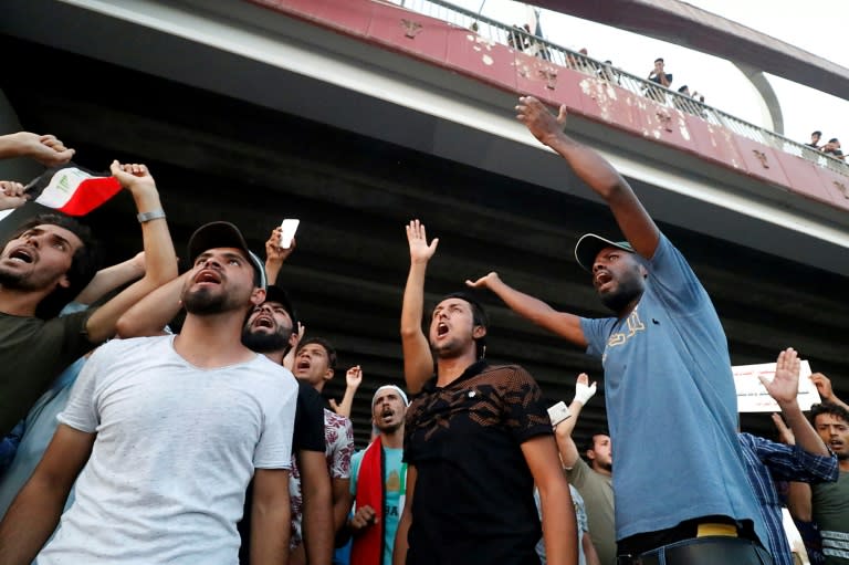 Iraqi men demonstrate in the southern oil-rich city of Basra -- the heart of recent protests against power shortages, graft and other social ills -- on August 3, 2018