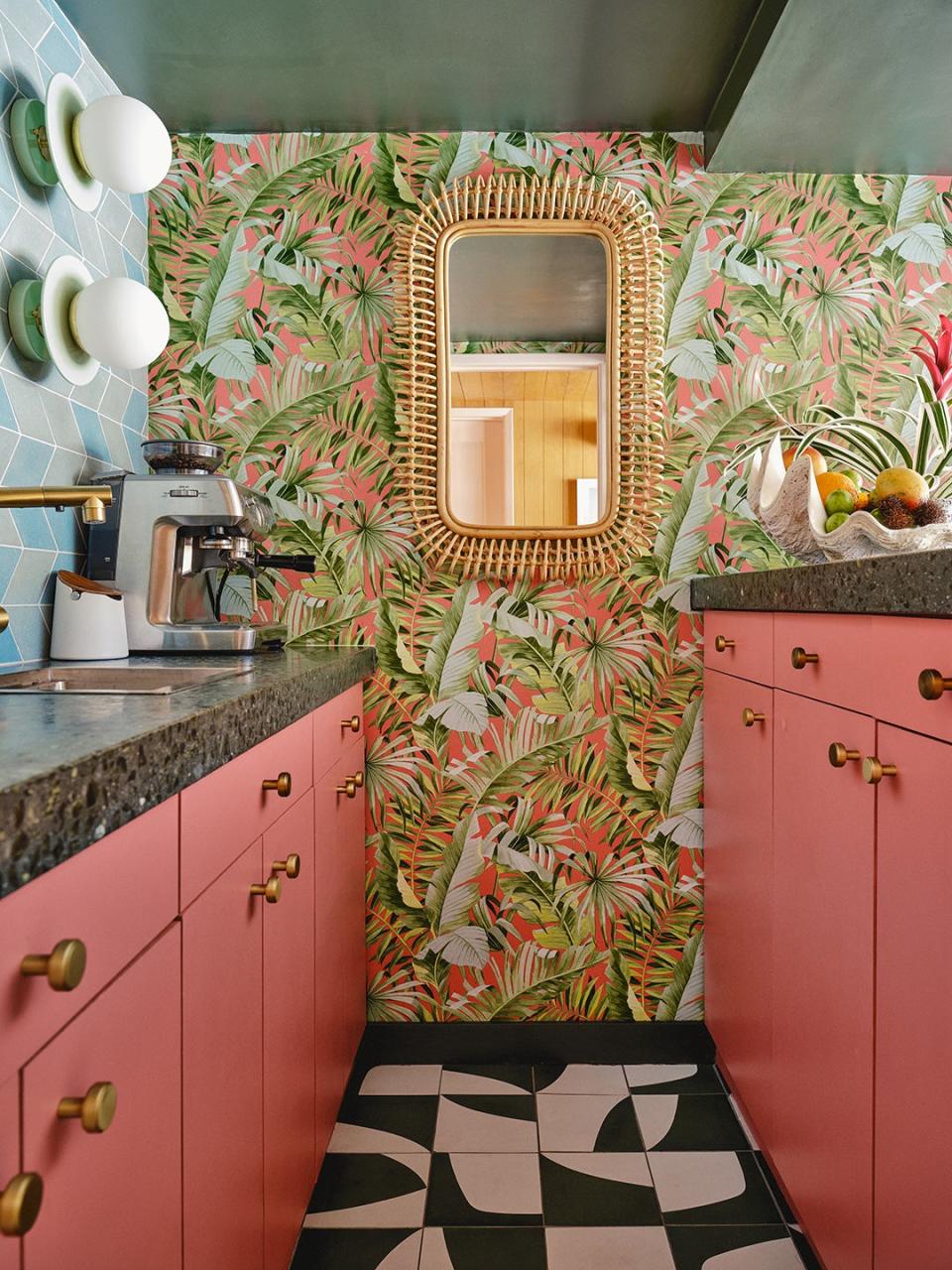 Alfresco Coral Tropical Palms Wallpaper, <u>A Street Prints</u>; Reflecting Rose Paint (on cabinets), <u>Valspar</u>.