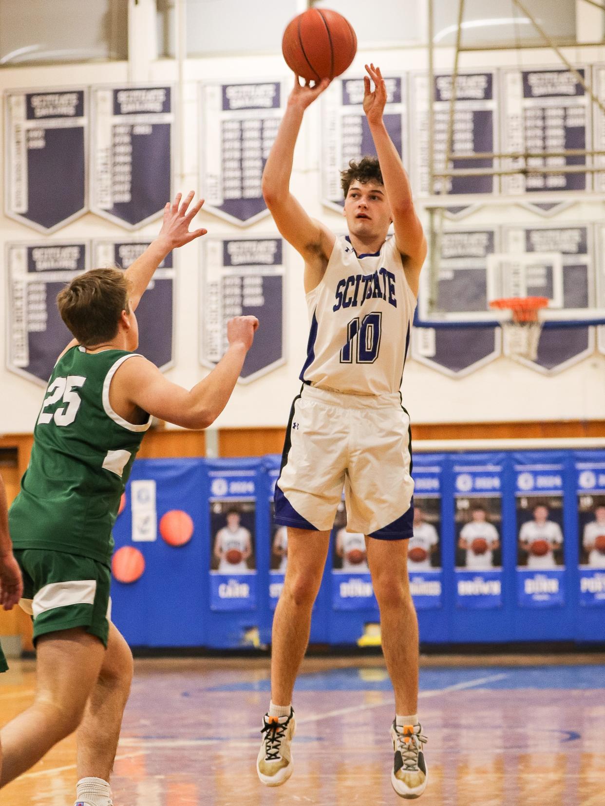Scituate's Michael Porter shoots the ball during a game against Marshfield at Scituate High School on Wednesday, Feb. 14, 2024.