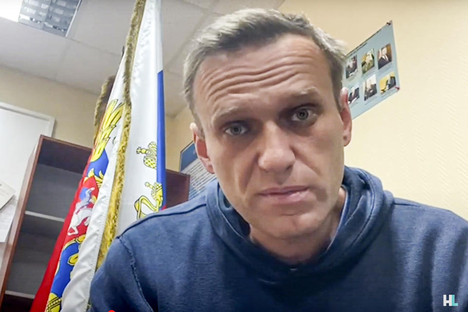 In this image taken from video released by Navalny Life youtube channel, Russian opposition leader Alexei Navalny speaks as he waits for a court hearing in a police station in Khimki, outside in Moscow, Russia, Monday, Jan. 18, 2021. A judge has ordered to remand Russian opposition leader Alexei Navalny in custody for 30 days, his spokeswoman Kira Yarmysh said on Twitter. The ruling Monday concluded an hours-long court hearing set up at a police precinct where the politician has been held since his arrest at a Moscow airport Sunday. (Navalny Life youtube channel via AP)