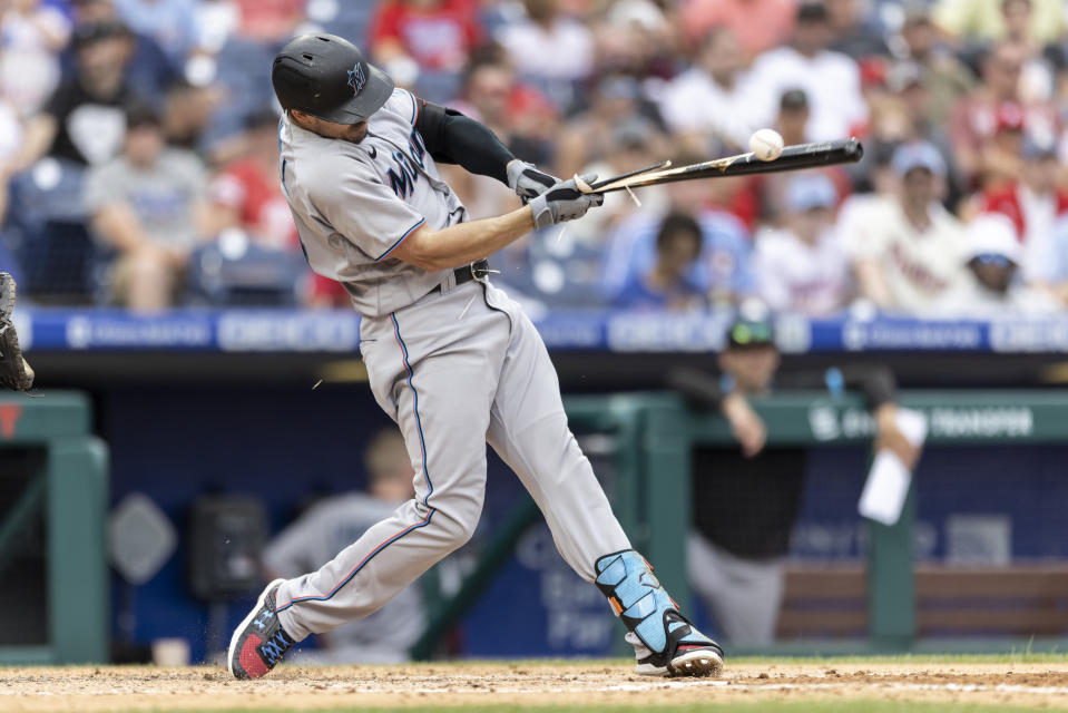 Miami Marlins' Adam Duvall breaks his bat on a single during the fourth inning of a baseball game against the Philadelphia Phillies, Sunday, July 18, 2021, in Philadelphia. (AP Photo/Laurence Kesterson)