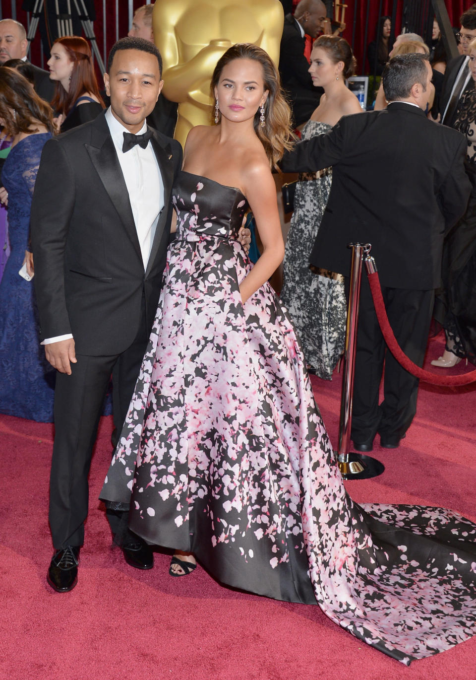 HOLLYWOOD, CA - MARCH 02:  Singer John Legend (L) and model Christine Teigen attend the Oscars held at Hollywood & Highland Center on March 2, 2014 in Hollywood, California.  (Photo by Michael Buckner/Getty Images)