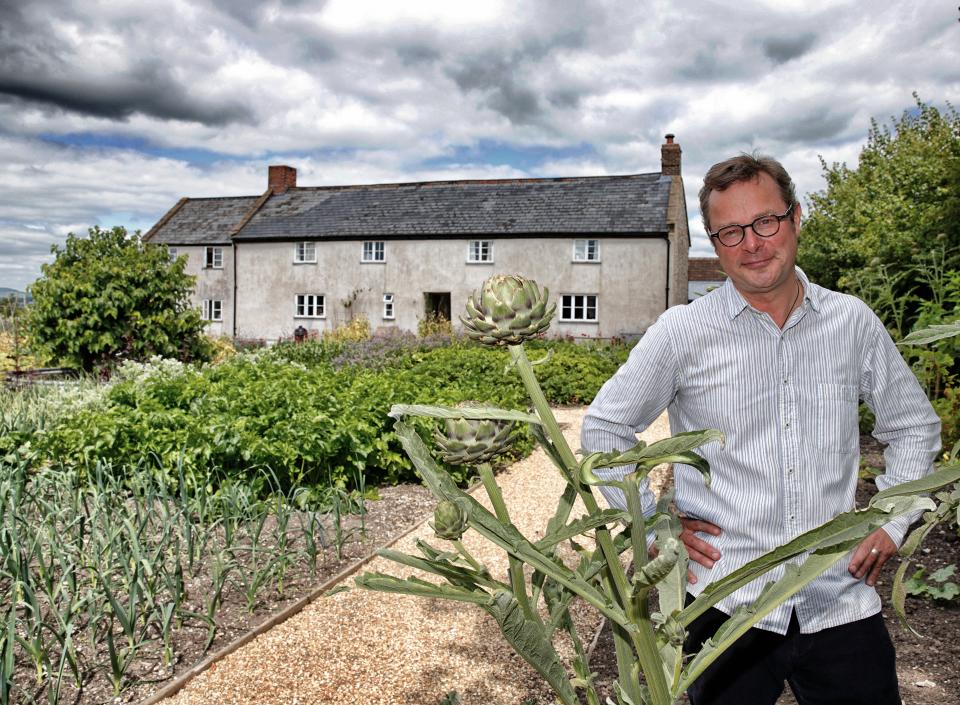 AXMINSTER, UNITED KINGDOM - JULY 15: (EMBARGOED FOR PUBLICATION IN UK NEWSPAPERS UNTIL 48 HOURS AFTER CREATE DATE AND TIME) - (EDITORS NOTE: This image was processed using digital filters.) Hugh Fearnley-Whittingstall stands in the vegetable garden of River Cottage HQ following a visit by Prince Charles, Prince of Wales and Camilla, Duchess of Cornwall on July 15, 2014 in Axminster, England. (Photo by Max Mumby/Indigo/Getty Images)