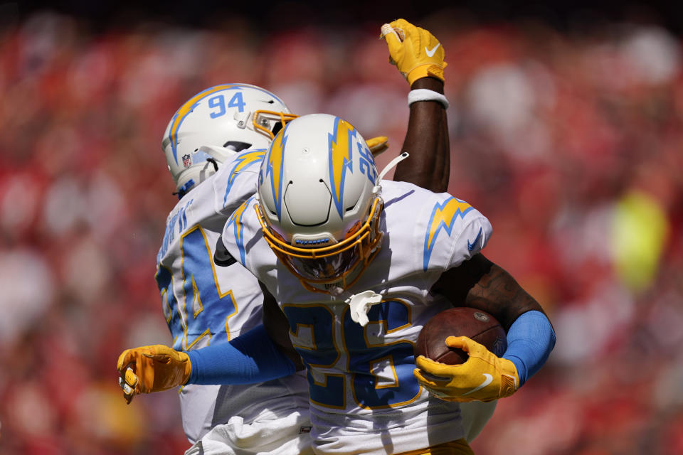 Los Angeles Chargers' Asante Samuel Jr. (26) celebrates an interception with Chris Rumph II (94) during the first half of an NFL football game against the Kansas City Chiefs, Sunday, Sept. 26, 2021, in Kansas City, Mo. (AP Photo/Charlie Riedel)