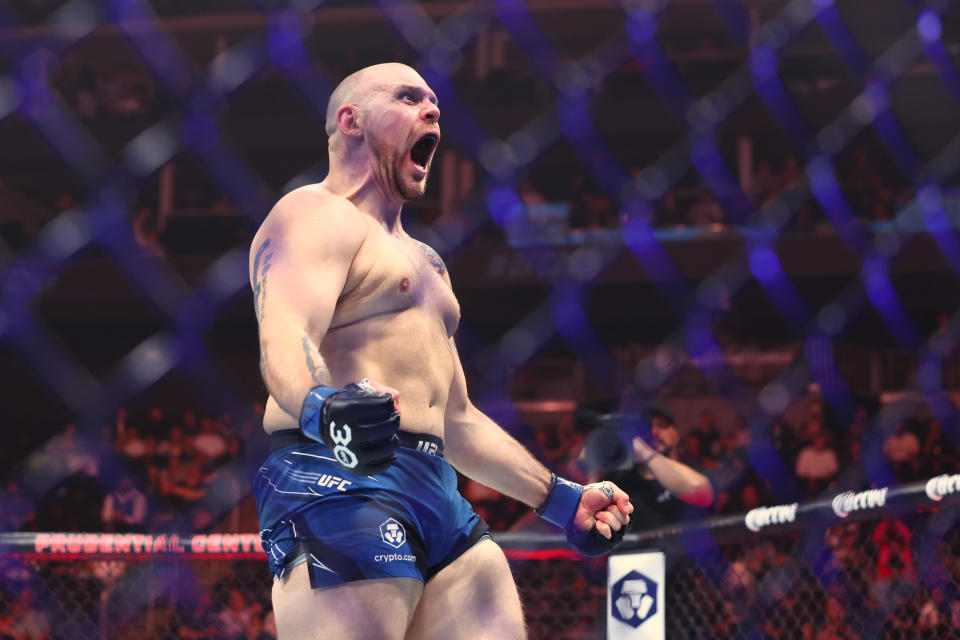 May 6, 2023; Newark, New Jersey, USA; Parker Porter (blue gloves) reacts after defeating Braxton Smith (red gloves) during UFC 288 at Prudential Center. Mandatory Credit: Ed Mulholland-USA TODAY Sports