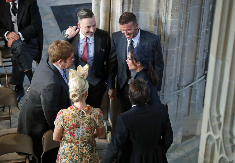  David and Victoria Beckham (right) talk with Sir Elton John and David Furnish (left) and Sofia Wellesley and James Blunt (foreground) at Meghan and Harry's wedding in May 2018 [Photo: Getty]