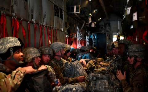 Soldiers in an Air Force C-130J Super Hercules at Ft. Knox, Kentucky being sent to assist Department of Homeland Security along the southwest border - Credit:  DANIEL A. HERNANDEZ/AFP