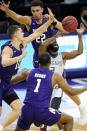 Chicago State guard Levelle Zeigler (2) can't control the ball as Northwestern forward Pete Nance (22), forward Miller Kopp, left, and guard Chase Audige guard during the first half of an NCAA college basketball game in Evanston, Ill., Saturday, Dec. 5, 2020. (AP Photo/Nam Y. Huh)