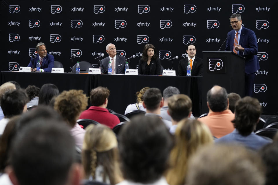 Keith Jones, from right, Philadelphia Flyers President of Hockey Operations, speaks during a news conference with Daniel Briere, Flyers General Manager, Valerie Camillo, President & CEO of Spectacor Sports and Entertainment, Dan Hilferty, Comcast Spectacor Chairman & CEO and Governor of the Flyers, and John Tortorella, Flyers Head Coach, at the NHL hockey team's arena, Friday, May 12, 2023, in Philadelphia. (AP Photo/Matt Slocum)