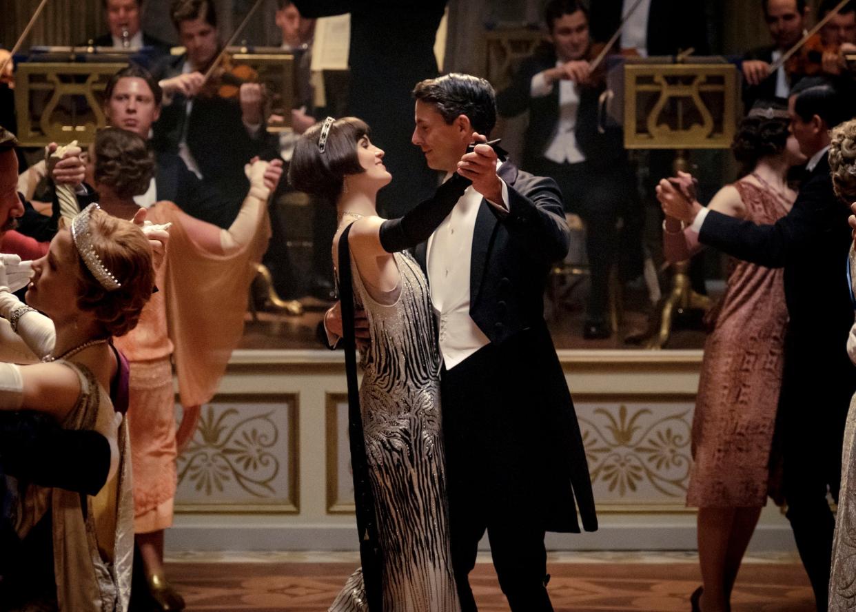 Michelle Dockery as Lady Mary Talbot, centre left, and Matthew Goode as Henry Talbot in a scene from the film: AP