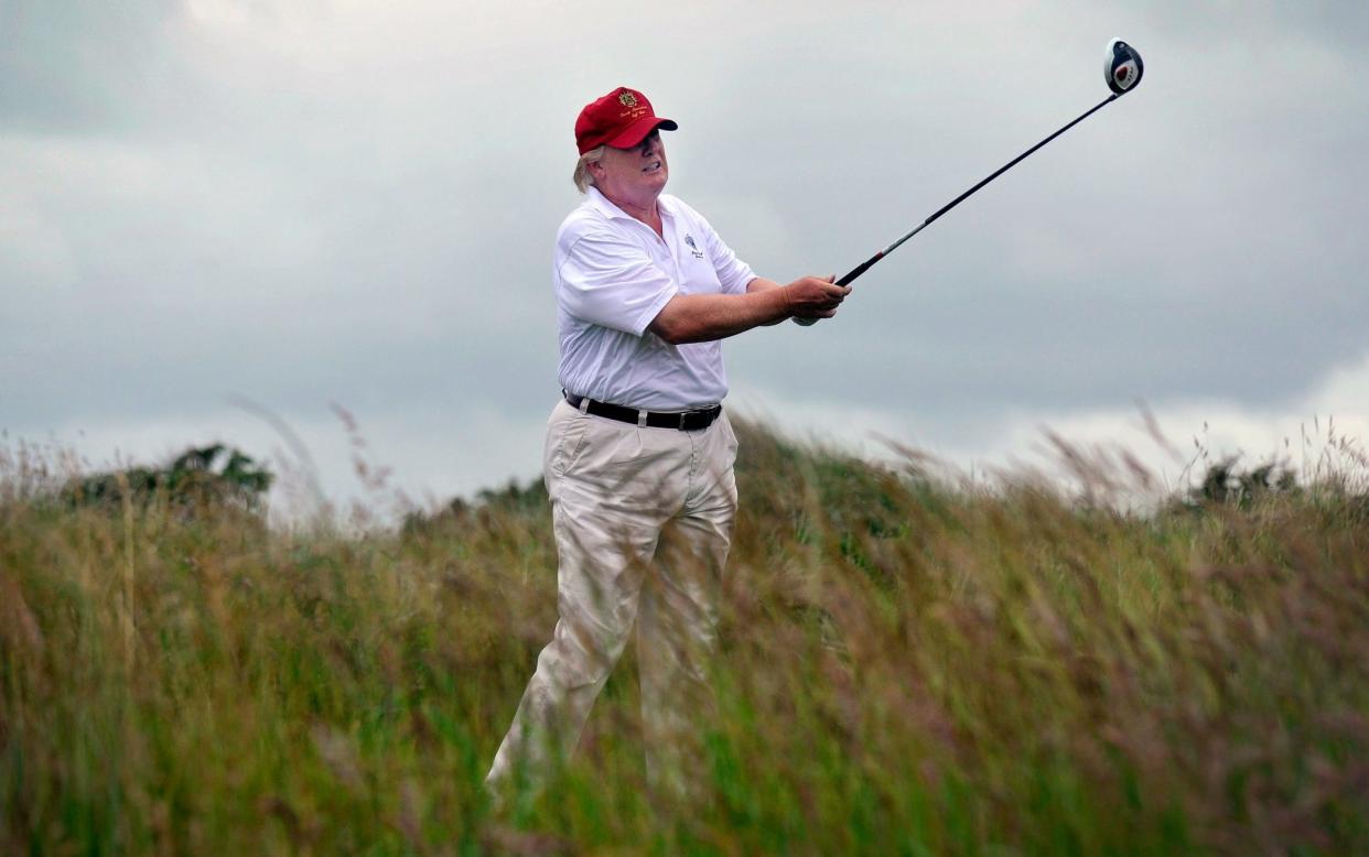 Donald Trump playing golf