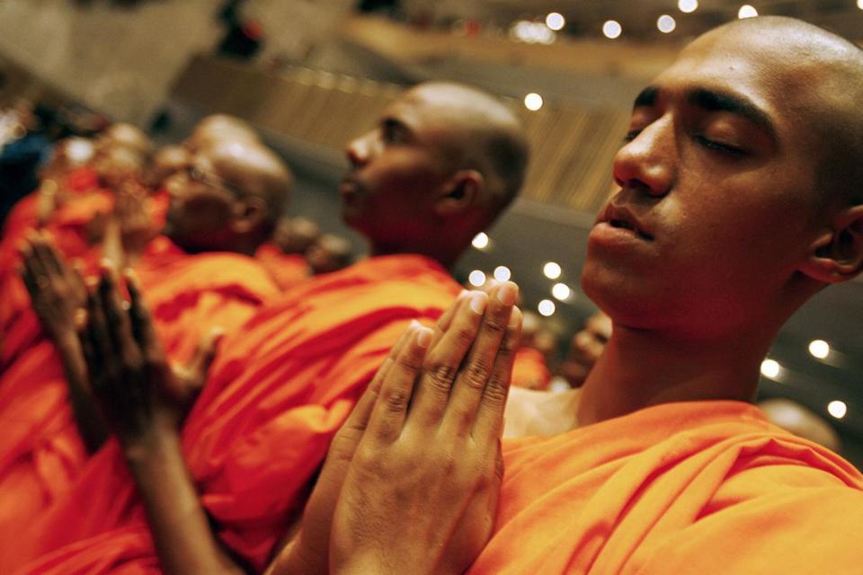 Buddhist monks pray during an International Conference on World Peace and Humanistic Buddhism in Mumbai, Maharastra (AFP/Getty Images)