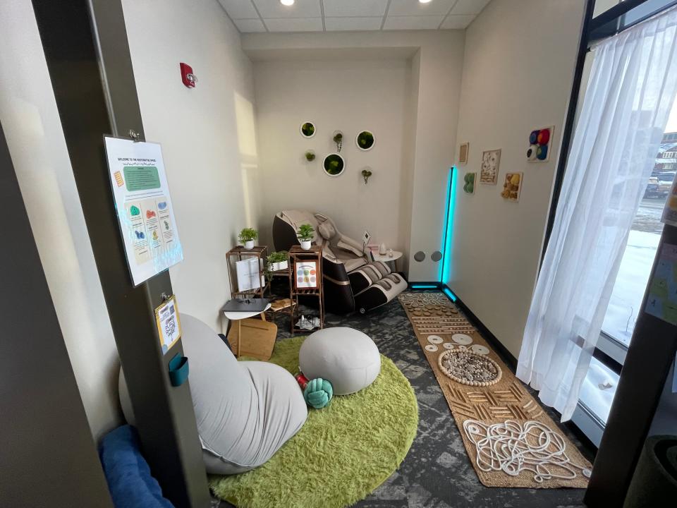 A restorative space in The Club Teen Center allows students to find calm with a massage chair, a yoga mat, beanbag chairs and a sensory pathway that's designed to improve well-being through interactive experience.