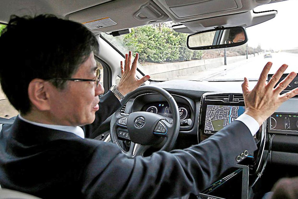 Look, no hands: the Nissan Leaf 'drives' through London in its first demonstration on public roads in Europe: Reuters