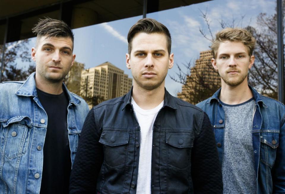Foster The People's Cubbie Fink, Mark Foster, and Mark Pontius, from left, pose for a photograph during the SXSW Music Festival on Thursday, March 13, 2014, in Austin, Texas. (Photo by Jack Plunkett/Invision/AP)