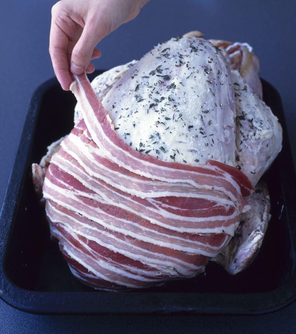 <p>“Smother your turkey in butter, then layer streaky bacon over it the night before it goes in the oven”, says Chloe who writes <a rel="nofollow noopener" href="https://gastronomicgorman.com/" target="_blank" data-ylk="slk:The Gastronomic Gorman;elm:context_link;itc:0;sec:content-canvas" class="link ">The Gastronomic Gorman</a>. “That will keep it lovely and moist while it cooks.” [Photo: Food and Drink/REX/Shutterstock] </p>