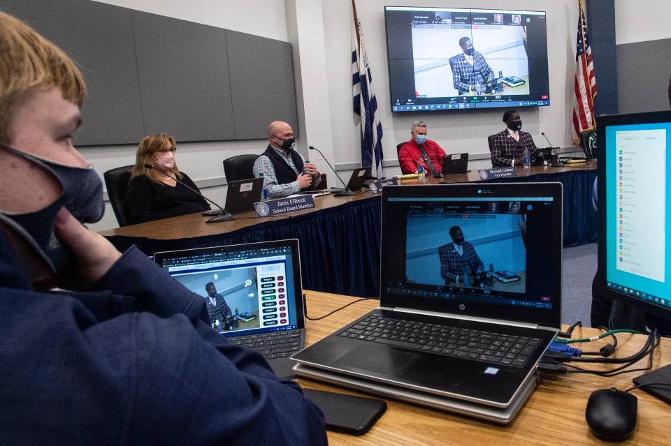 Members of the Millcreek Township School Board listen to the public at a study session on pandemic regulations on Feb. 22, 2022, at the Millcreek School District's Education Center. The board voted later that month to make masks optional.