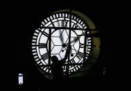 <p>V. Kunasegaran 60, oils the Gillett & Johnston gears, manufactured in England inside the Sultan Abdul Samad building’s 118-year-old clock tower at Independent square on August 30, 2016 in Kuala Lumpur, Malaysia. (Mohd Samsul Mohd Said/Getty Images) </p>