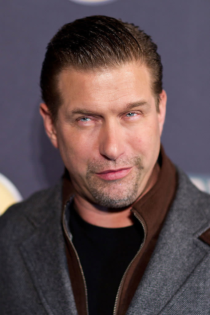 Stephen Baldwin in a dark jacket and shirt giving a slight smile at an event