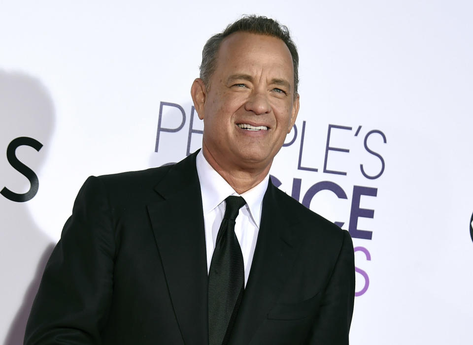 FILE - In this Wednesday, Jan. 18, 2017, file photo, Tom Hanks arrives at the People's Choice Awards at the Microsoft Theater in Los Angeles. Hanks will host a 90-minute primetime TV special celebrating the inauguration of Joe Biden as president of the United States. (Photo by Jordan Strauss/Invision/AP, File)