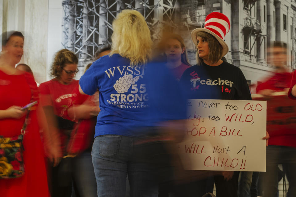 Teachers and school personnel demonstrate outside the House of Delegates chamber at the West Virginia State Capitol in Charleston, W.Va. on the second day of a statewide strike by teachers and school personnel on Tuesday, February 20, 2019. (Craig Hudson/Charleston Gazette-Mail via AP)