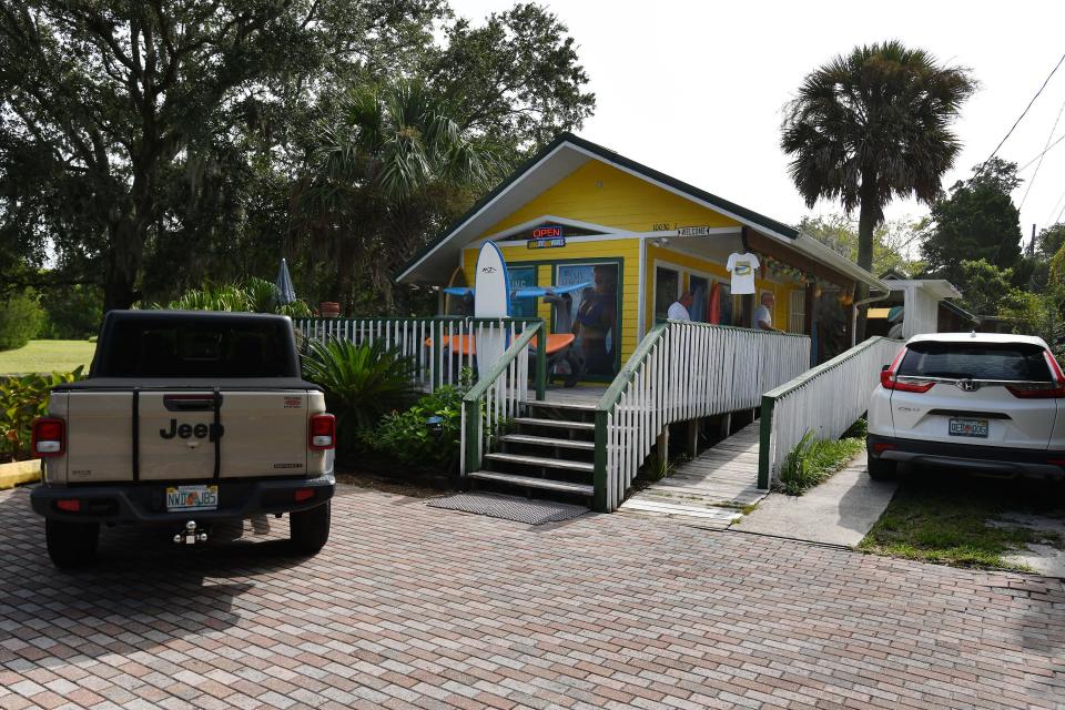 The tiny Fort George Surf Shop retains the same footprint as when Jim Rodgers bought the building in 1974, though over the years Rodgers built a deck around it, extended the roofline and painted it a traffic-stopping bright yellow.