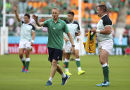 Ireland's coach Joe Schmidt, left, gestures as his team warm's up ahead of the Rugby World Cup Pool A game at Shizuoka Stadium Ecopa, between Japan and Ireland in Shizuoka, Japan, Saturday, Sept. 28, 2019. (AP Photo/Eugene Hoshiko)