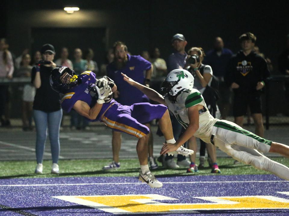 Williamsvilles Mason Lyttaker catches the game-tying touchdown pass as time expires in regulation in a Sangamo Conference football game against Athens at Paul Jenkins Field on Friday, Sept. 22, 2023. The Bullets won 36-35 in overtime.