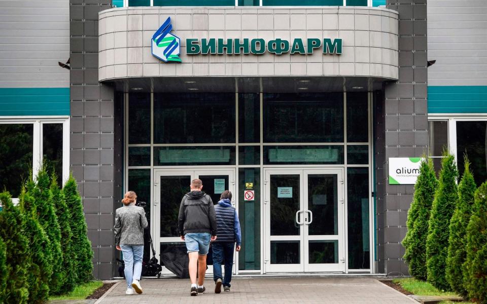 Scientists at the pharmaceutical factory Binnofarm have begun producing the vaccine but there is international scepticism about its efficacy - ALEXANDER NEMENOV /AFP