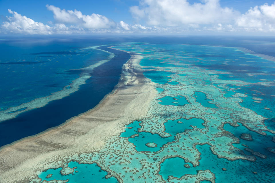 FILE - This photo provided by the Great Barrier Reef Marine Park Authority shows the Hardy Reef near the Whitsunday Islands, Australia on June 22, 2014. The Great Barrier Reef is the largest living structure on the planet _ so large, in fact, that it is the only living thing on earth visible from space. (Jumbo Aerial Photography/Great Barrier Reef Marine Park Authority via AP)