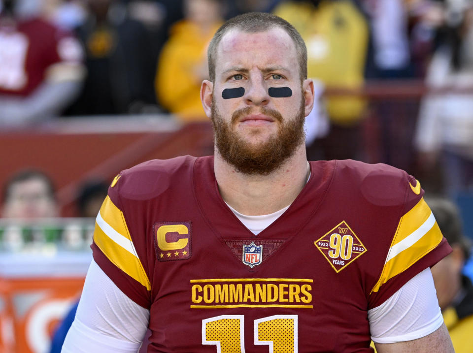 LANDOVER, MD - JANUARY 1: Washington Commanders quarterback Carson Wentz (11) stands for the national anthem prior to his start against the Cleveland Browns at FedEx Field on January 1, 2023. (Photo by Jonathan Newton/The Washington Post via Getty Images)