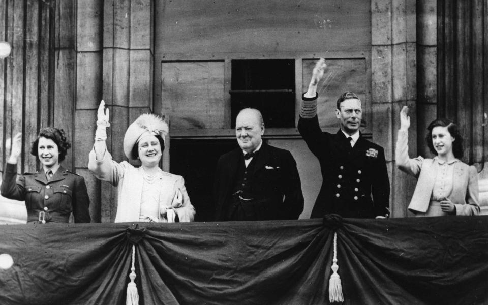 L-R: Princess Elizabeth, Queen Elizabeth, Sir Winston Churchill, King George VI and Princess Margaret on VE Day 1945 - PA