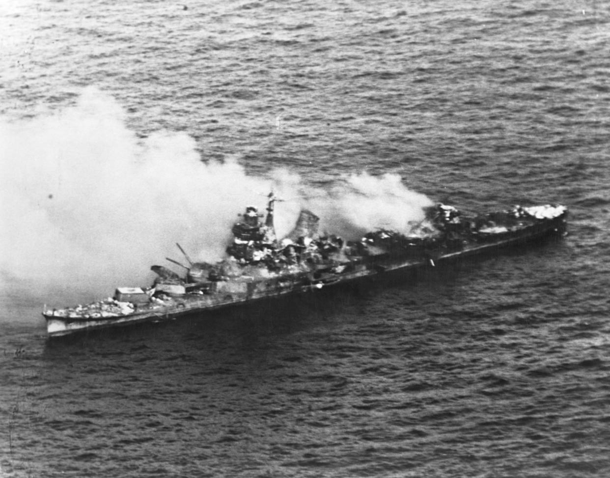 A Japanese Mogani class cruiser burns after being bombed in the Battle of Midway in June 1942.