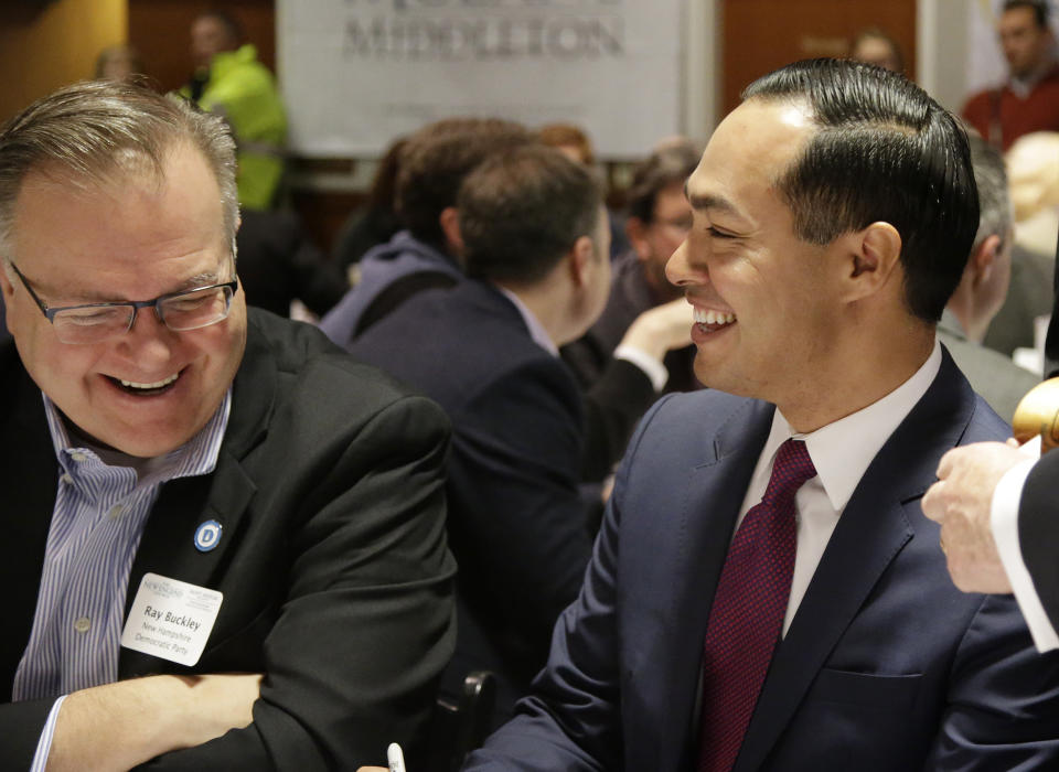 Julian Castro, former U.S. Secretary of Housing and Urban Development and candidate for the 2020 Democratic presidential nomination, right, shares a laugh with Ray Buckley, chair of the New Hampshire Democratic party, before speaking at Saint Anselm College, Wednesday, Jan. 16, 2019, in Manchester, N.H. (AP Photo/Mary Schwalm)
