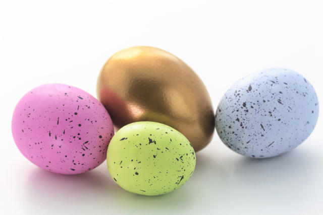 Gold nest eggs with pink, green, and blue nest eggs reflect diversified investment success and growth