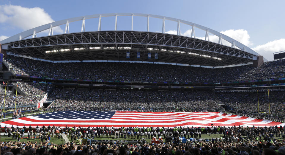 In the post 9/11 world, unfurling a giant American flag has become normal prior to football games. (AP)