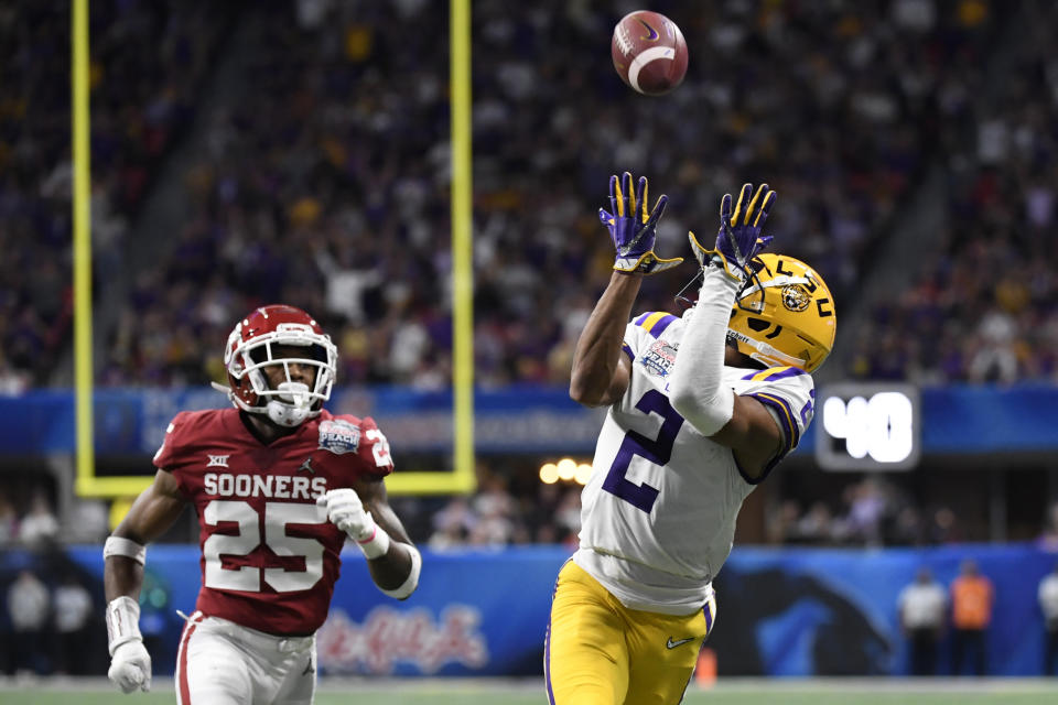LSU wide receiver Justin Jefferson (2) prepares for a touchdown catch against Oklahoma safety Justin Broiles (25) during the first half of the Peach Bowl NCAA semifinal college football playoff game, Saturday, Dec. 28, 2019, in Atlanta. (AP Photo/Danny Karnik)