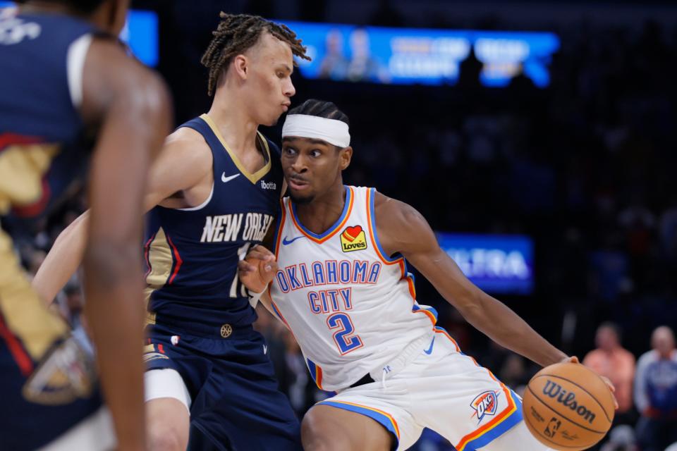 Oklahoma City Thunder guard Shai Gilgeous-Alexander (2) tries to get past New Orleans Pelicans guard Dyson Daniels (11) during an NBA basketball game between the Oklahoma City Thunder and the New Orleans Pelicans at Paycom Center in Oklahoma City, Wednesday, Nov. 1, 2023. The Thunder lost 110-106.