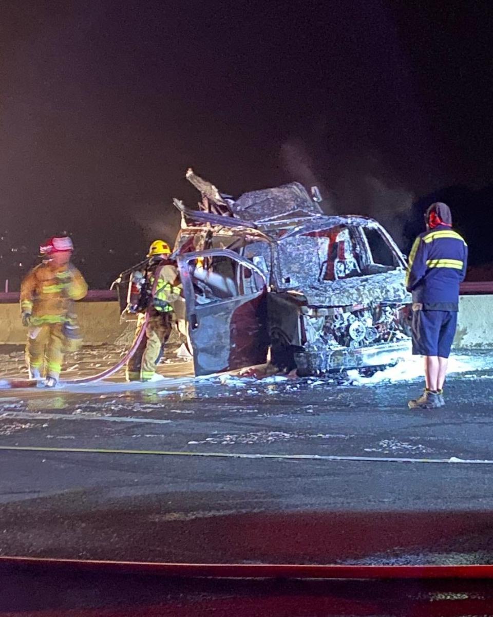 Firefighters extinguish a blaze in a taco van after propane tanks exploded on southbound Highway 101 along the Conejo Grade early Sunday. No injuries were reported.